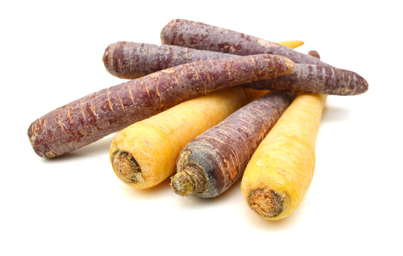 Bunch of fresh organic rainbow carrots isolated on white