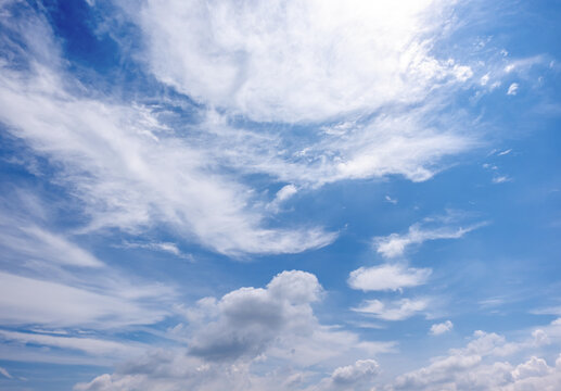 clear blue sky background,clouds with background, Blue sky background with tiny clouds. White fluffy clouds in the blue sky. 
Captivating stock photo featuring the mesmerizing beauty of the sky and cl