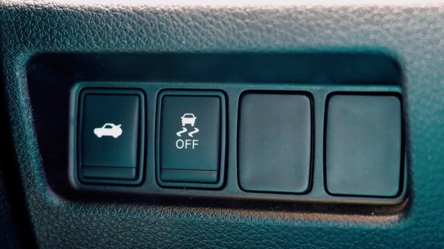 Macro of electronic stability traction control off switch in car