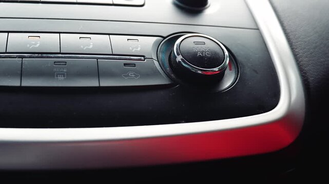 Max air conditioning knob and climate controls on car dashboard