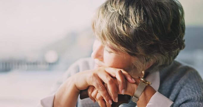 Thinking, memory and senior woman in home with cane, contemplating and nostalgia. Retirement, elderly person and reflection in house with perspective, calm mindset and introspection by window
