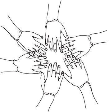 Group of diverse people hands joined together in a circle as a symbol of unity and teamwork