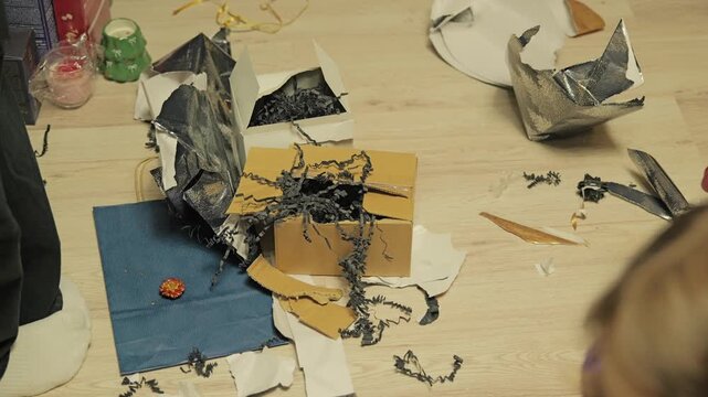 Discarded wrapping materials capture authentic family celebration mood