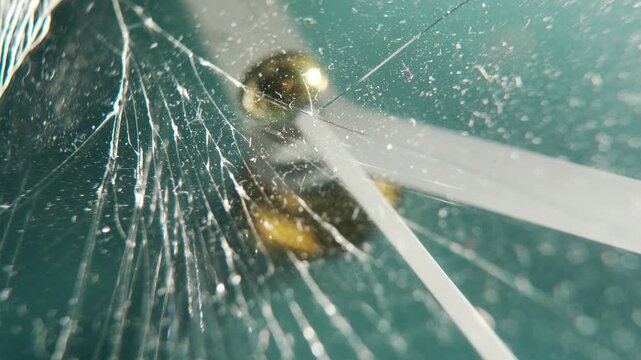 Close-Up of Broken Glass Texture on a Working Analog Clock Face &ndash; Time, Damage, and Fragility Concept
