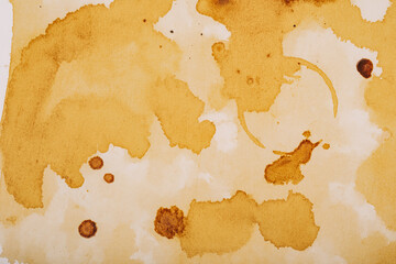 Close up of coffee stains on textured paper surface for grunge backgrounds