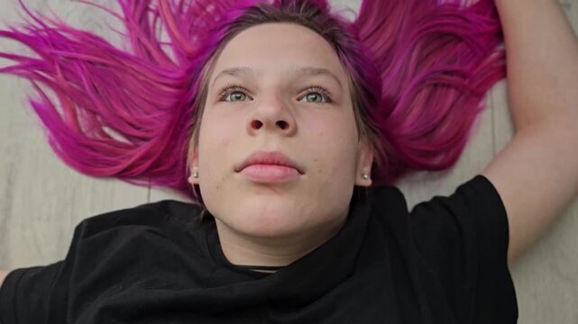 A teenage girl portrays pain, suffering, and ill health. Suicidal thoughts, depression or despair, drug addiction and drug resistance, and a vacant look.