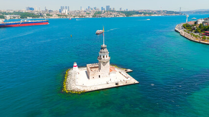 Istanbul, Turkey. Historic Maiden Tower Kiz Kulesi on rocky islet in Bosphorus with water taxis and small boats passing by on sunny day. Aerial View © Video Render