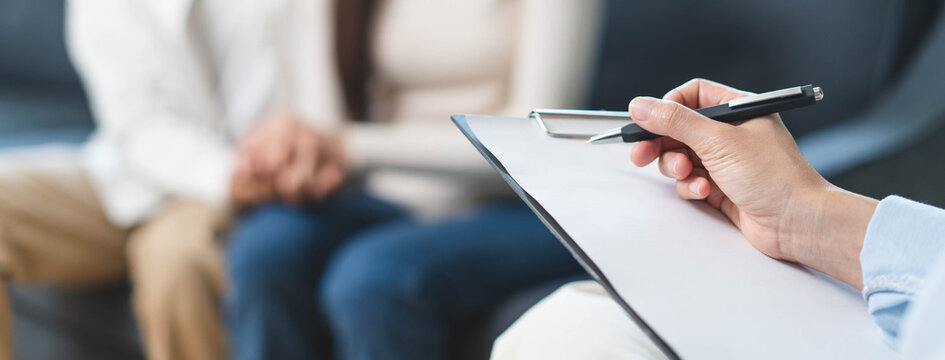 Spouses relationship consultant concept, Married couple listen to psychologist  during therapy talk session for married couple that mental health breakdown and relationship problems.