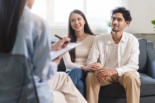 Spouses relationship consultant concept, Married couple listen to psychologist  during therapy talk session for married couple that mental health breakdown and relationship problems.