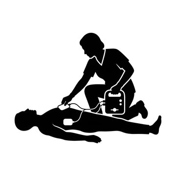 Medical professional using an aed defibrillator on a patient