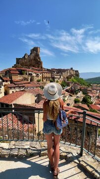 Woman tourist looking at ancient medieval village, Famous touristic village of Frias in Spain, Burgos, Castilla y Le&oacute;n