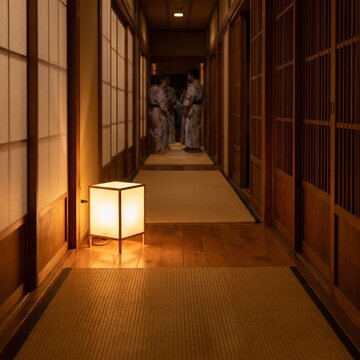 Traditional Japanese Ryokan Hallway At Night With Andon Lantern