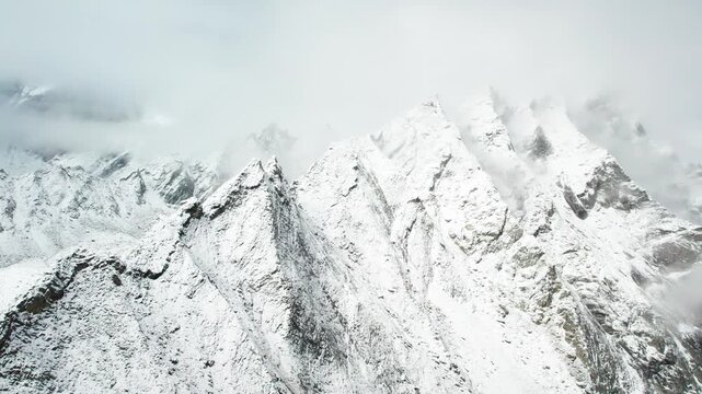Drone view of beautiful snow covered mountains, close up view of Ama Drime Snow Mountai in Dingjie, Shigatse, Tibet, China. Travel concept 4k real time footage aerial view.