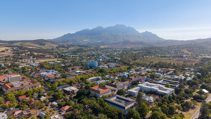 Stellenbosch, South Africa - January 24, 2026: Aerial view of Stellenbosch on a sunny summer day. Blue skies and charming architecture showcase one of the Cape Winelands' most beautiful towns.