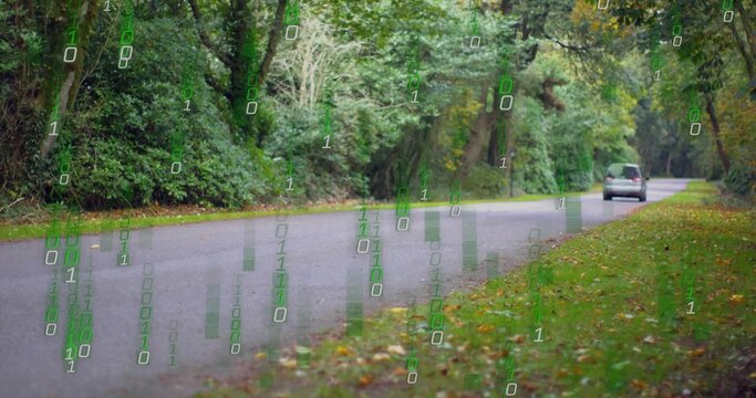 On van entering frame, minivan moving right, receding while binary digits rising to show data flow