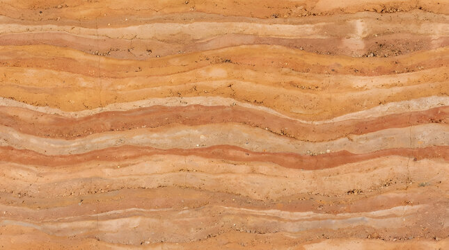 Layers of red clay and sandy soil earth patterns representing land of North America.