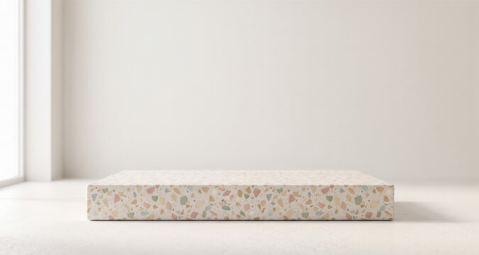 Empty rectangular terrazzo stone podium standing on bright clear floor against blank beige background representing minimalist modern interior 3d product presentation stage