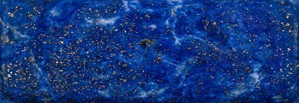 Vibrant deep blue lapis lazuli stone with sparkling golden pyrite inclusions, a rich mineral texture offering a and celestial background, for decorative arts, jewelry, and cosmic