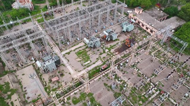 Cinematic drone flight over a high voltage electric power station in Jammu.