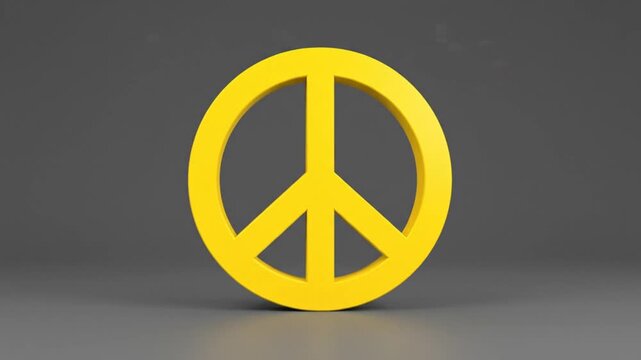 Bright yellow peace symbol standing against a gray background evoking harmony, hope, and social justice.