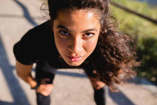 Portrait of sportive young woman having a break
