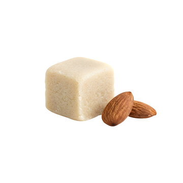 A single cube of almond marzipan paste with fresh raw almond nuts isolated on transparent background