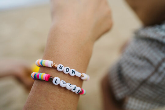 Hand of woman wearing name bracelet