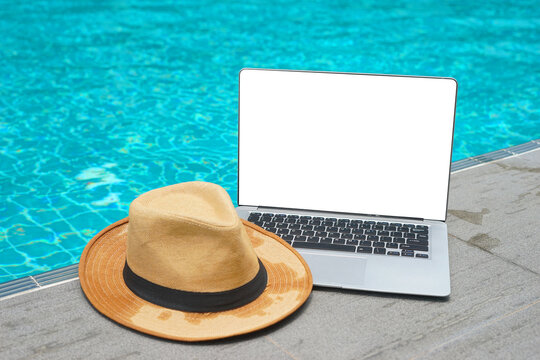 Laptop nearby swimming pool. Vacation working on laptop in holiday online meeting working digital Freelance work concept, Traveler working online using computer while traveling on summer vacation