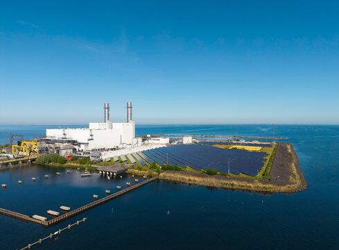 Gas fired power station and solar panel at IJsselmeer lake