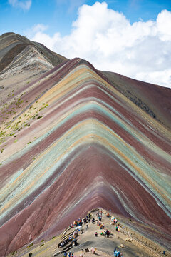 Breathtaking vinicunca rainbow mountain landscape with vibrant colorful peak under blue sky