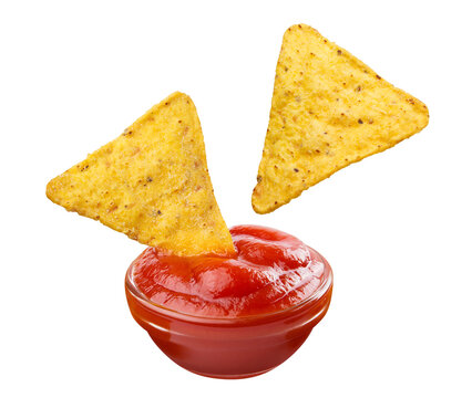 Delicious nacho tortilla chips dipping into tomato sauce, isolated on transparent cutout background