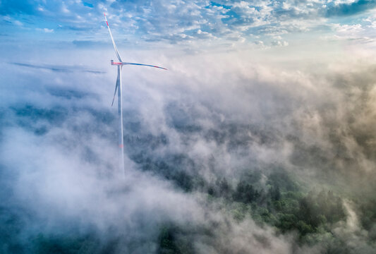 Germany, Baden-Wuerttemberg, Schurwald, Aerial view of wind wheel and morning fog