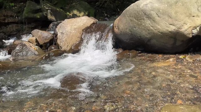 Clear mountain stream flowing over natural rocks 57