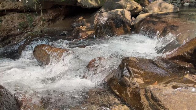 Clear mountain stream flowing over natural rocks 59