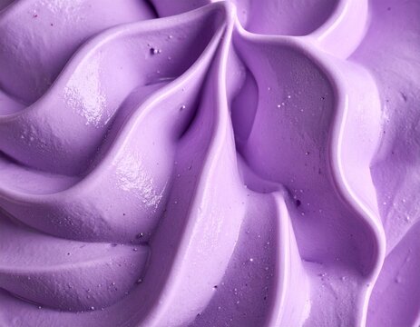 Macro close up of smooth violet gelato cream with star shaped swirl and bright soft lighting