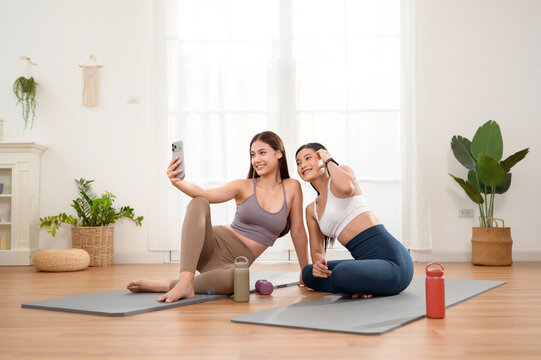 Friends Share a Moment While Practicing Yoga and Relaxing in a Bright Room
