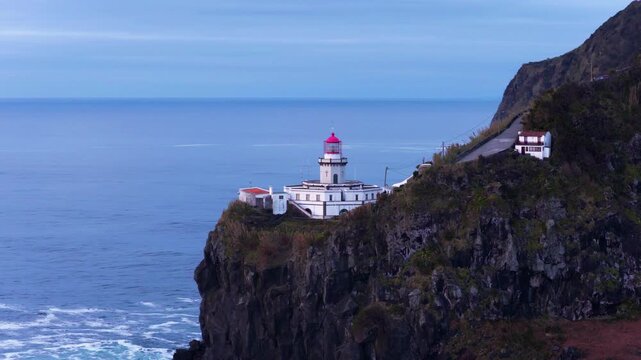 Historic Lighthouse Of Ponta do Arnel Over Rugged Coastal Cliffs On S&atilde;o Miguel Island In The Azores, Portugal. Aerial Shot