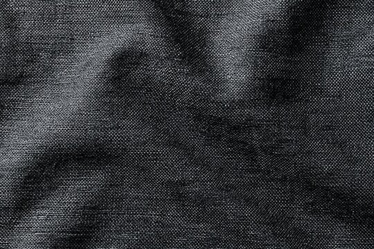Close-up of textured fabric with soft shadow pattern background