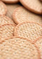 Obraz premium Light brown baked cookies in big pile close up. Background of crispy cookies