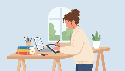 Fototapeta premium Creative young woman illustrating on a digital tablet at her desk with books and plants shows modern remote work or artistic design process.