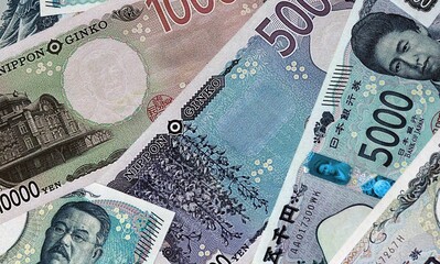 Japanese yen money bills in pile. Big amount of Japan JPY currency cash close up © Viktor