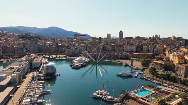 Aerial view of Genoa&rsquo;s Porto Antico marina with yachts, city buildings, and waterfront