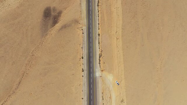 Drone flight over Mitzpe Ramon desert road and mountains