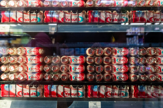 Villa de Alvarez, Colima. Mexico. June 24, 2026: Yakult Probiotic Drink Packs Displayed on a Supermarket Refrigerated Shelf