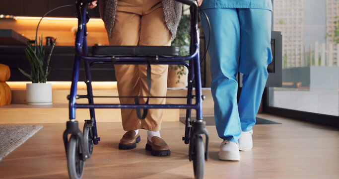 Legs, rehabilitation and walker with people in clinic together for balance or stability. Healthcare, physiotherapy and walking frame on wheels for exercise or recovery of patient in wellness session