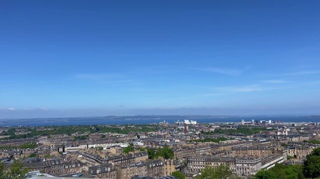 Panoramic view of Edinburgh, Scotland from Calton Hill, historic Old Town skyline, Edinburgh Castle, iconic city on rolling hills, famous European travel destination
