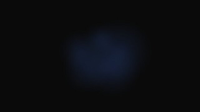 A subtle glowing blue nebulous light soft focus against a dark background