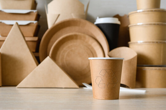 Paper cup with a recycling symbol. Made from recycled paper. Zero waste.