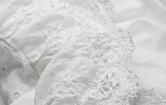 Handmade embroidered lace close-up, rotating background, top view, vintage, hand made. details of vintage blouse with hand embroidery 
