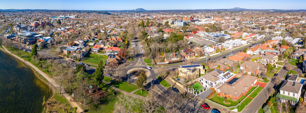 Aerial panorama veiw of a sprawling regional city around a lakeshore